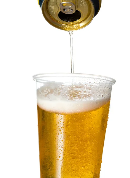 Golden lager or beer in disposable plastic cup — Stock Photo, Image