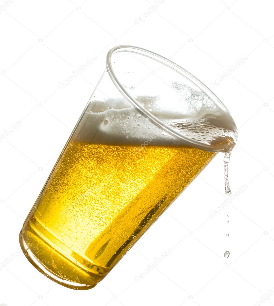 Golden lager or beer in disposable plastic cup