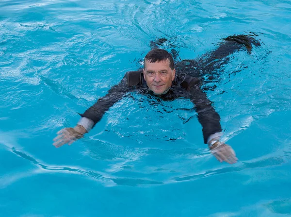 Senior business man in deep water in suit — Stock Photo, Image