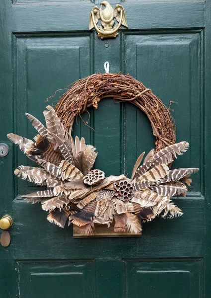 Traditional xmas wreath on front door — Stock Photo, Image