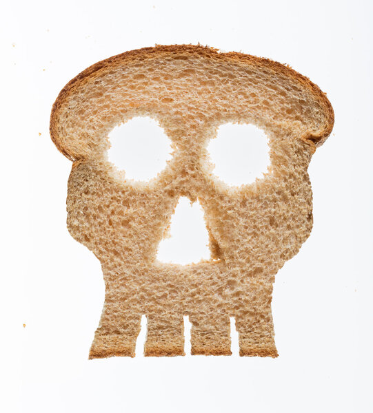 Slice of wholewheat bread in shape of skull