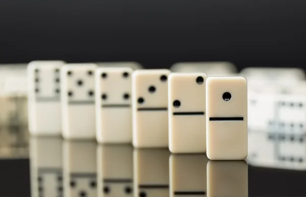 White dominoes showing leader or winner — Stock Photo, Image