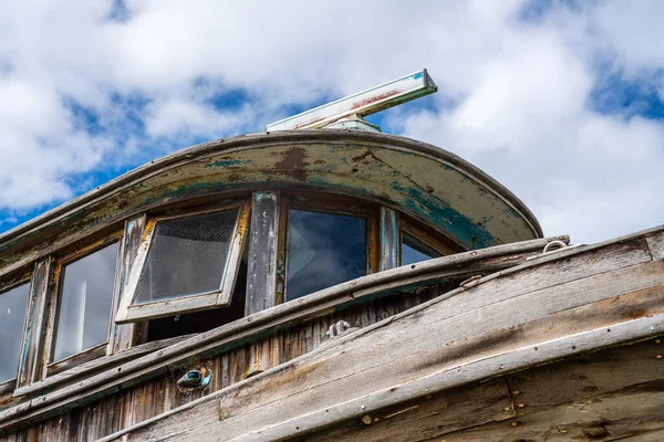 Detail of the cabin aboard abandoned fishing boat beached at Icy Strait Point in Alaska