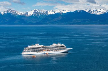 Hoonah, AK - 7 June 2022: Viking Orion cruise ship anchored at Icy Strait Point Alaska with passenger tenders