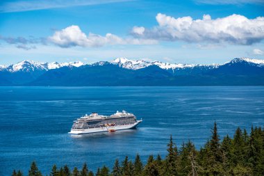 Hoonah, AK - 7 June 2022: Viking Orion cruise ship anchored at Icy Strait Point Alaska with passenger tenders