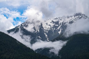 Misty view of Mt Menzies seen from cruise ship in the Discovery Passage in British Columbia