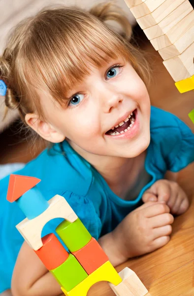 Child plays with toy blocks — Stock Photo, Image