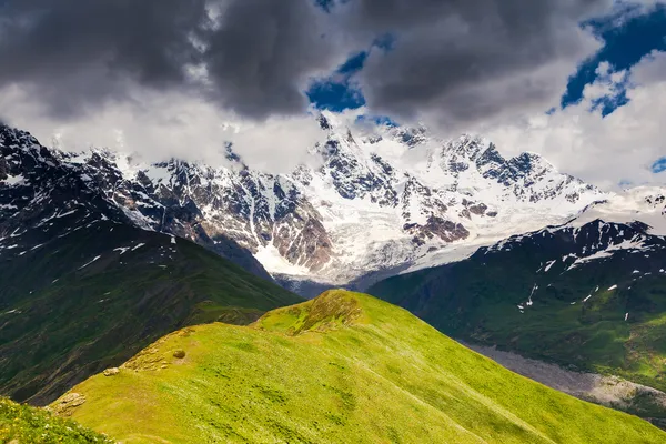 Alpine meadows with dramatic sky — Stock Photo, Image