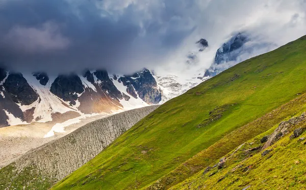 Alpine meadows with dramatic sky — Stock Photo, Image