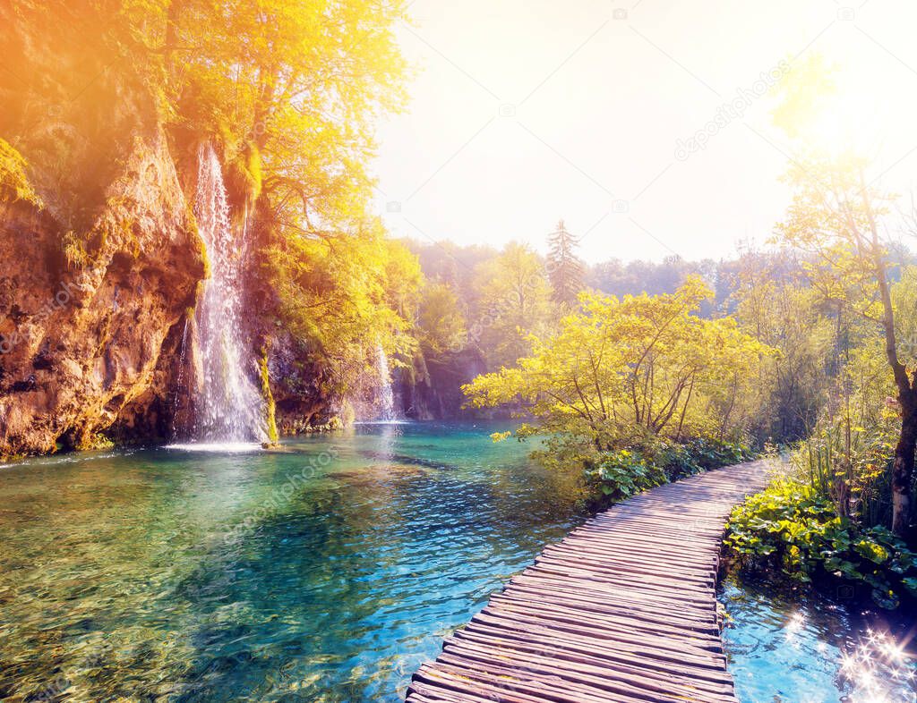 Majestic view on  lake and sunny beams in the Plitvice Lakes National Park. Croatia. Europe. Dramatic scene. Beauty world. Cross processed retro and vintage style. Instagram toning effect. Soft filter