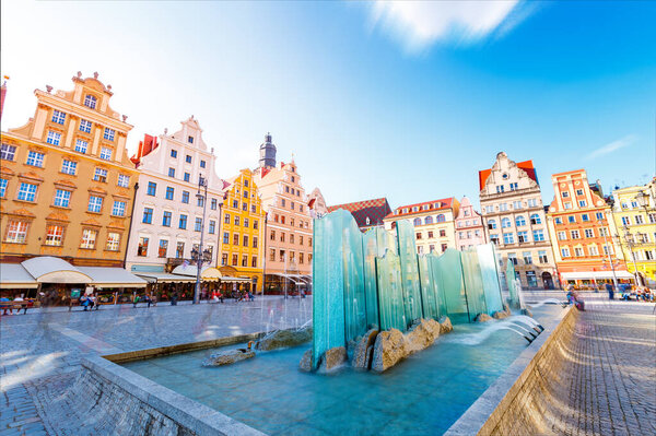 Fantastic view of the ancient homes on a sunny day. Gorgeous picture and picturesque scene. Location famous Market Square in Wroclaw, Poland, Europe. Historical capital of Silesia. Beauty world.