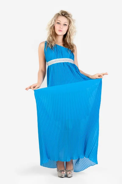 Young woman in blue dress posing in studio. — Stock Photo, Image