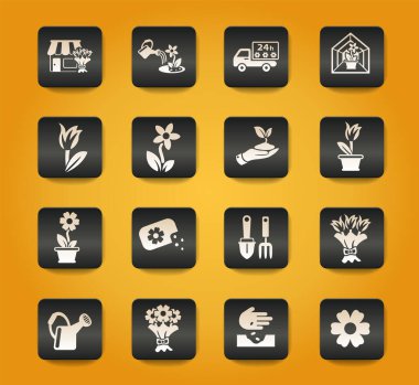 sarı arkaplanda siyah düğmelerdeki çiçek sembolleri