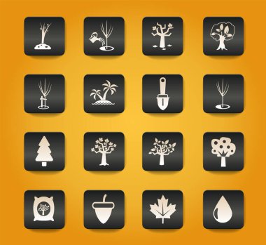 Sarı arkaplandaki siyah düğmelerdeki ağaç sembolleri