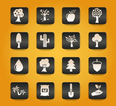 Sarı arkaplandaki siyah düğmelerdeki ağaç sembolleri