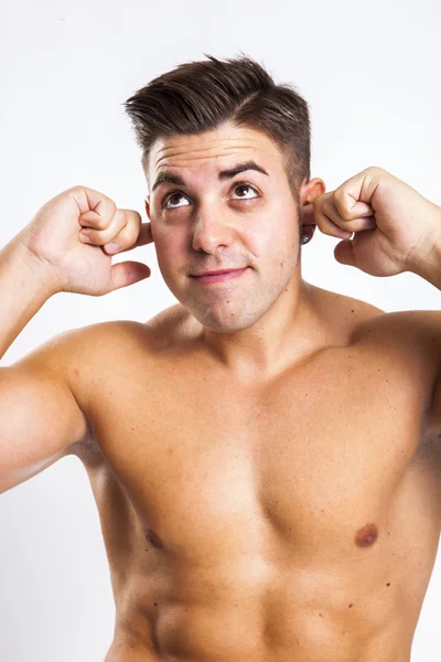 Expression of a young fit man in white background — Stock Photo, Image