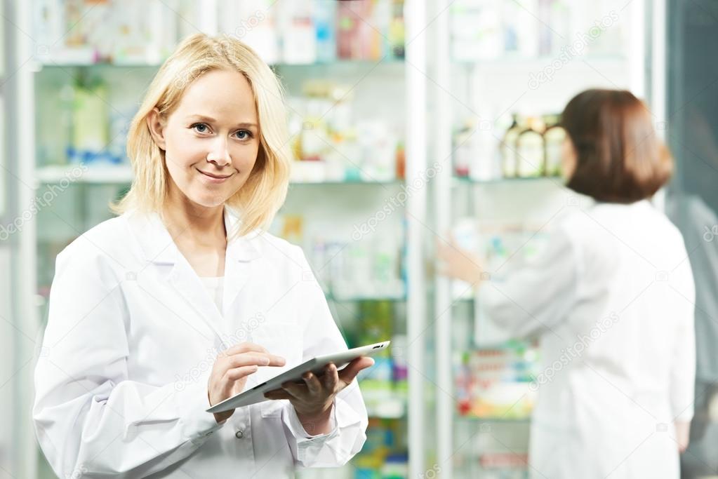 Happy Pharmacy chemist woman in drugstore