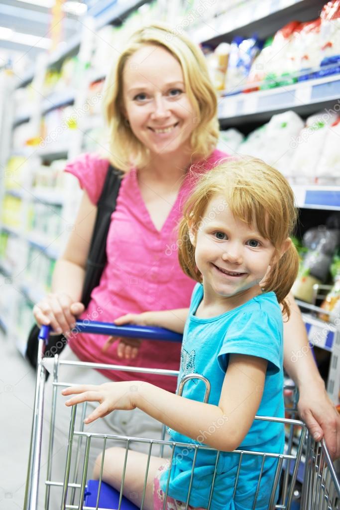 Woman and little girl making shopping