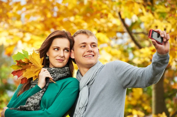 Young Couple at autumn outdoors