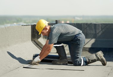 Flat roof covering works with roofing felt clipart