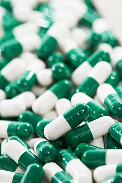 White green capsule pills with medicine antibiotic — Stock Photo, Image