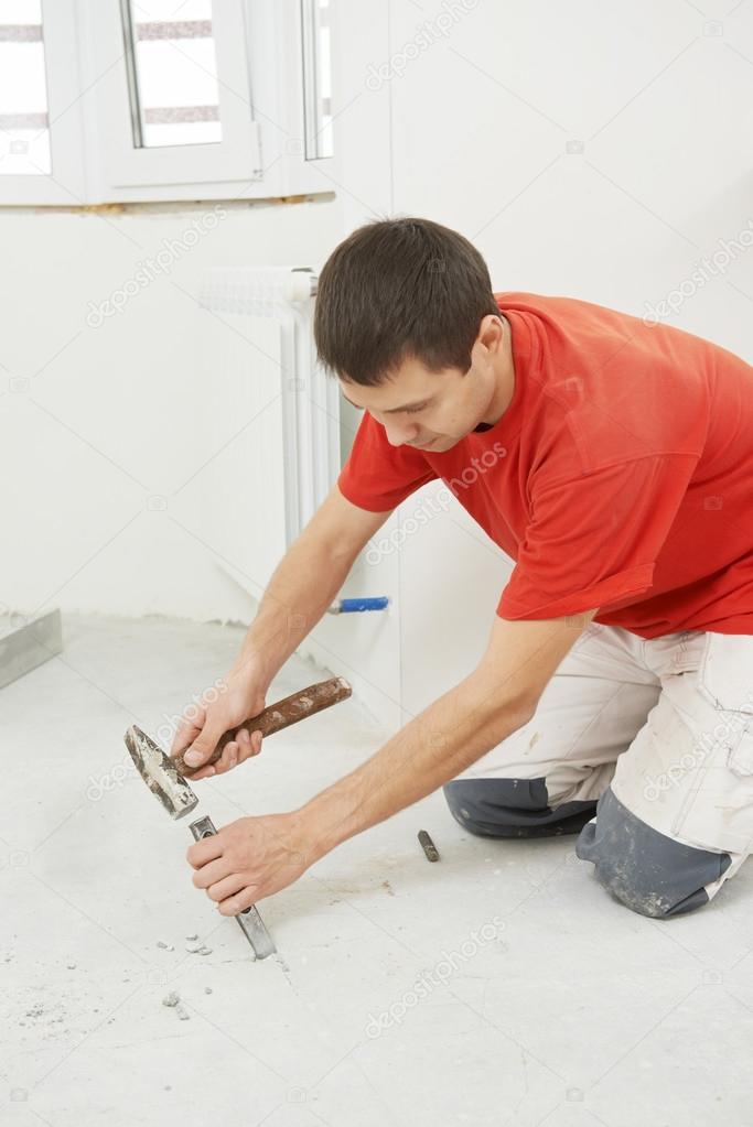 Parquet Floor worker with hammer