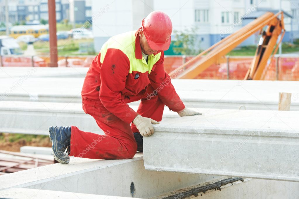 Builder worker installing concrete slab