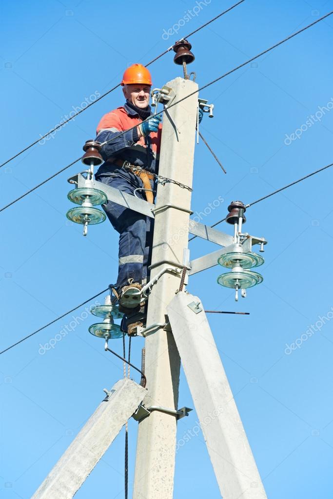 Power electrician lineman at work on pole — Stock Photo © kalinovsky