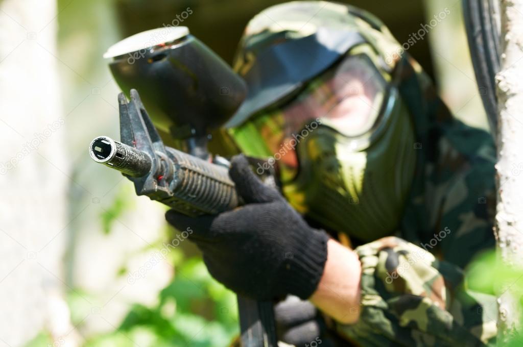 paintball player in summer. Shallow DOF