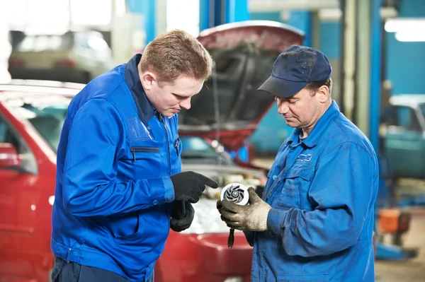 Two car mechanic diagnosing auto engine problem — Stock Photo, Image