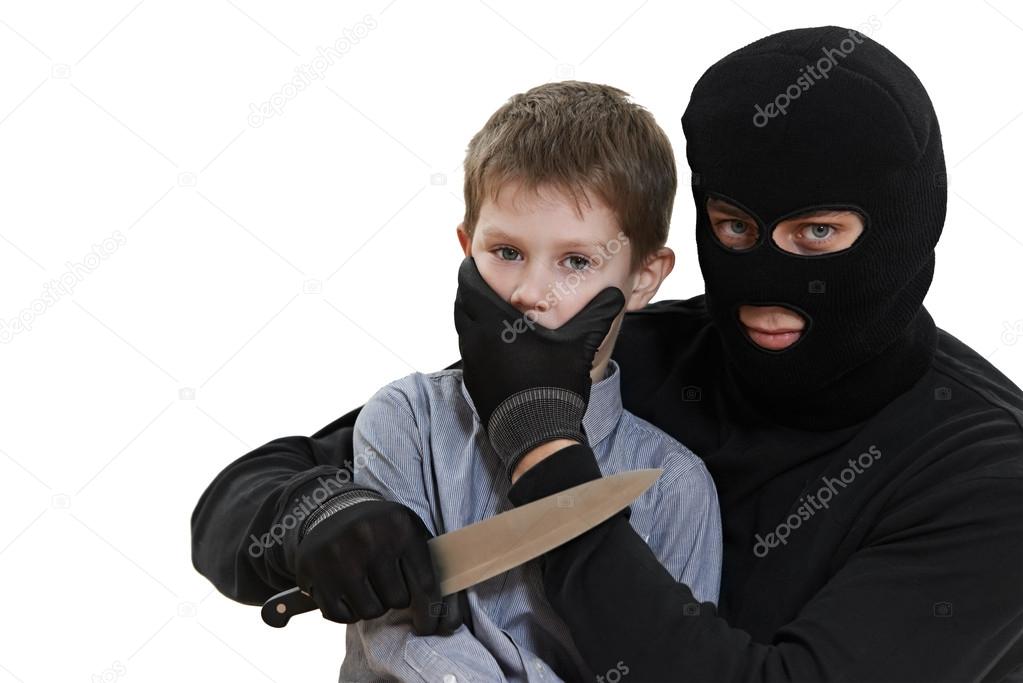 Thief kidnapper with child isolated