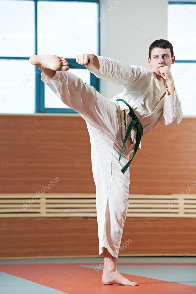 Man at taekwondo exercises