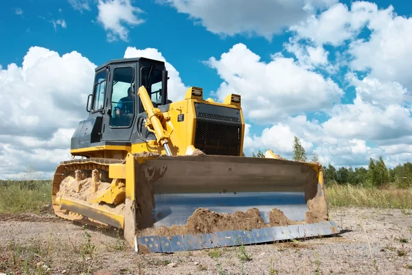 Spår-typ lastare bulldozern grävmaskin på jobbet — Stockfoto