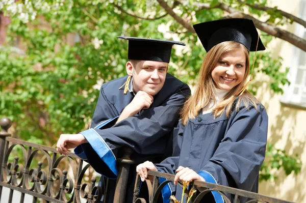 Happy graduate students outdoors — Stock Photo, Image