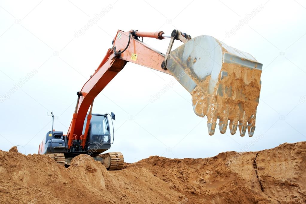 Track-type loader excavator at work