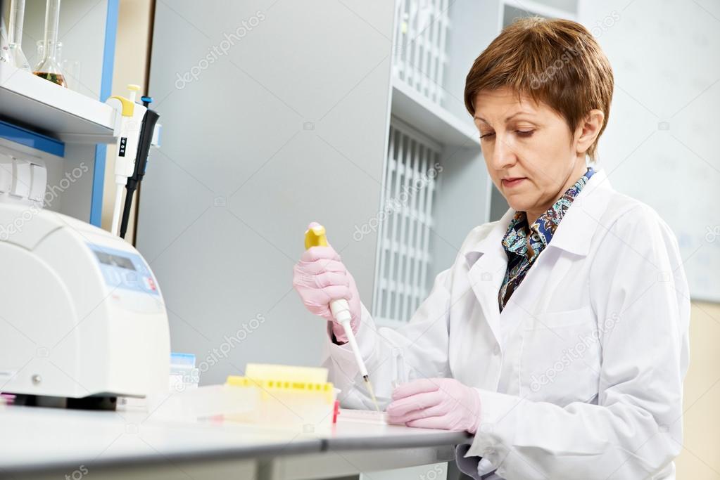 Scientist with Dropper at laboratory