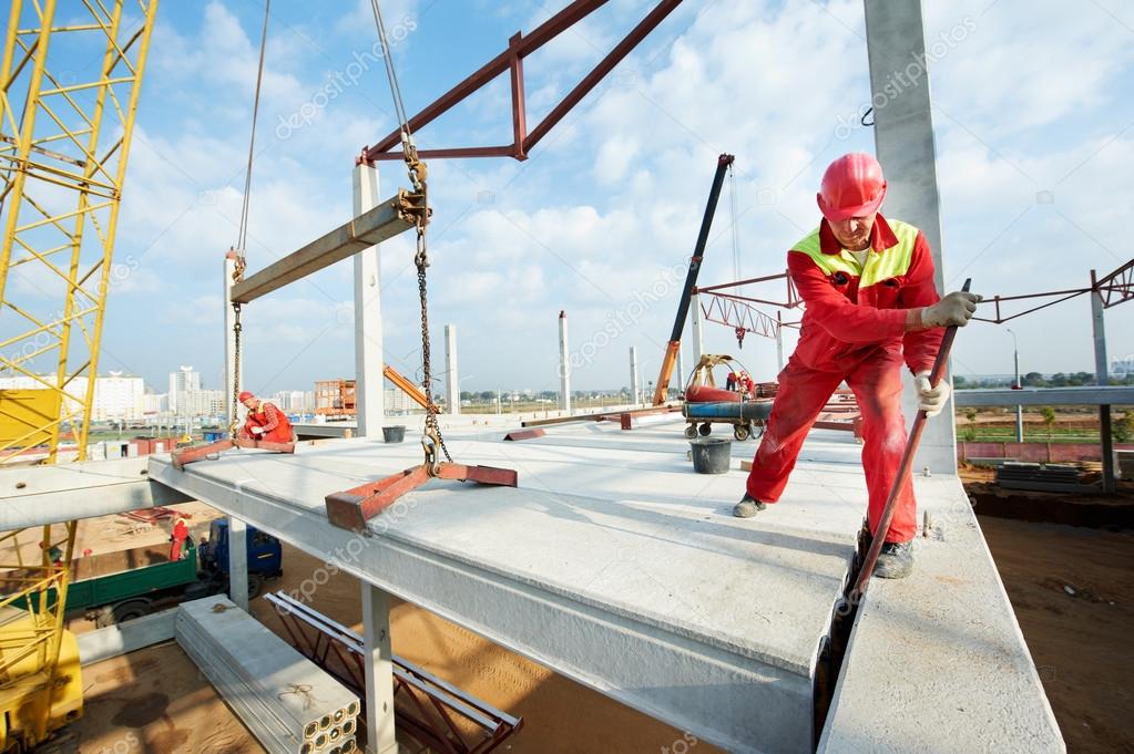 Builder worker installing concrete slab