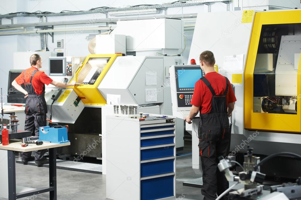 Two workers at tool workshop