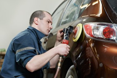 Auto mechanic polishing car clipart
