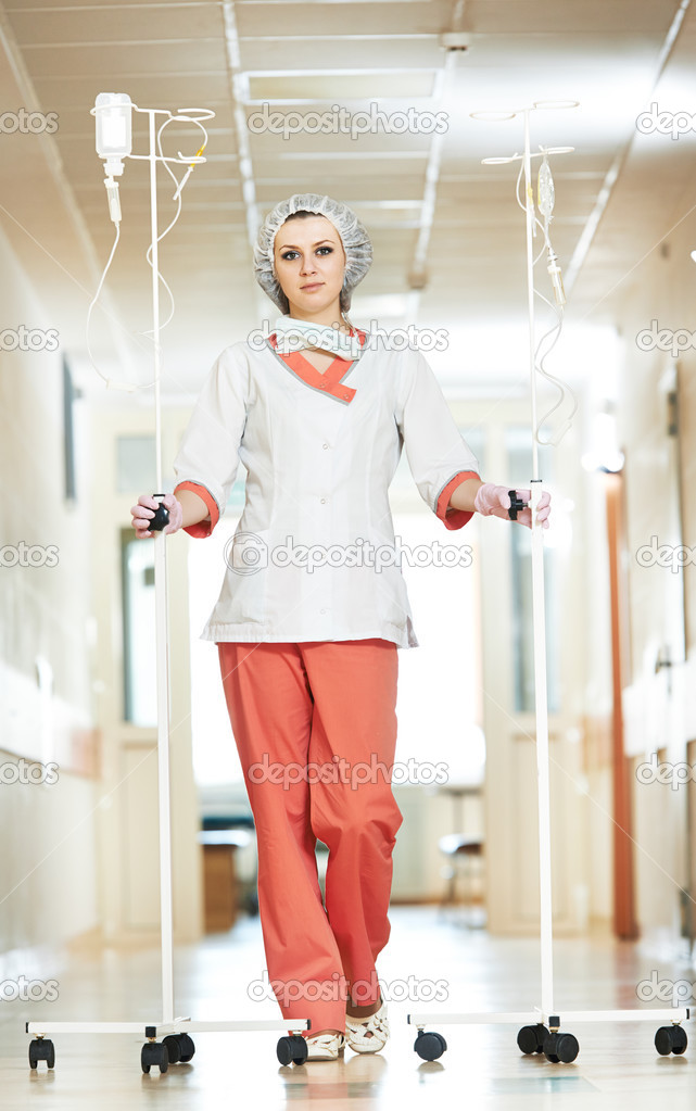 Young medic nurse with droppers in hospital