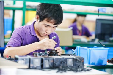 Chinese male worker at manufacturing