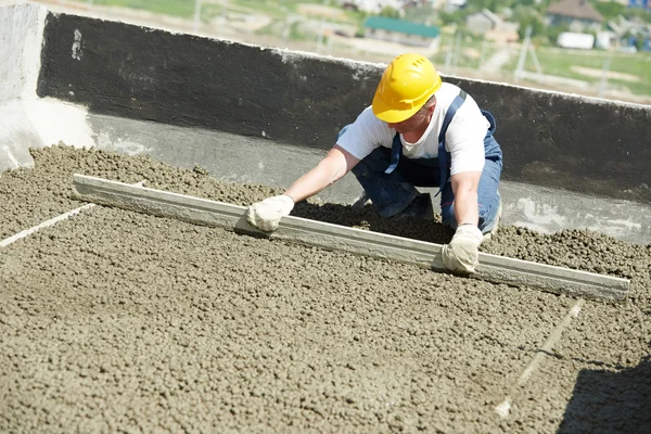 Worker roofer with float lute — Stock Photo, Image