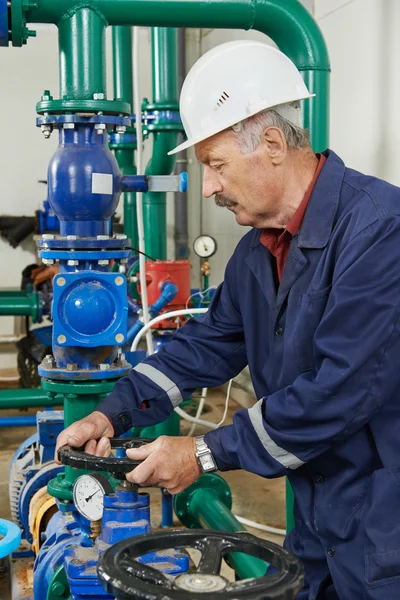 Heating engineer repairman in boiler room — Stock Image Heating engineer repairman in boiler room Stock Photo