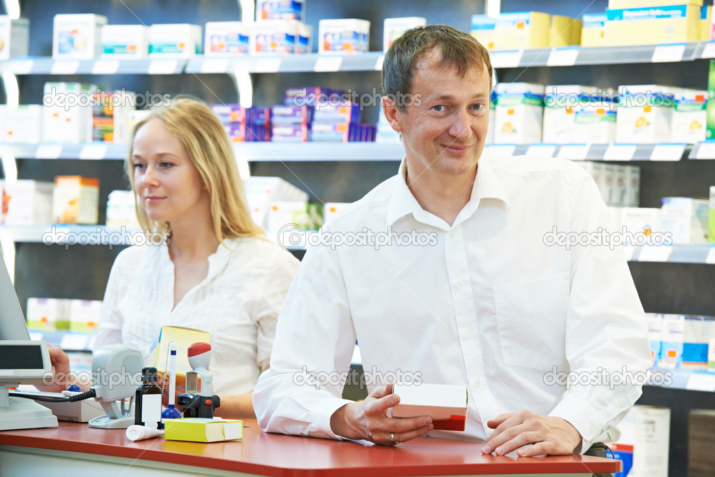 Pharmacy chemist workers in drugstore