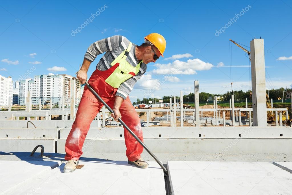 Builder worker installing concrete slab