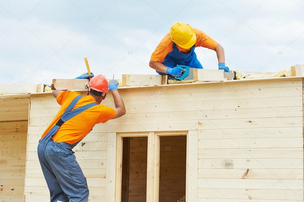 Carpenters at wooden roof work