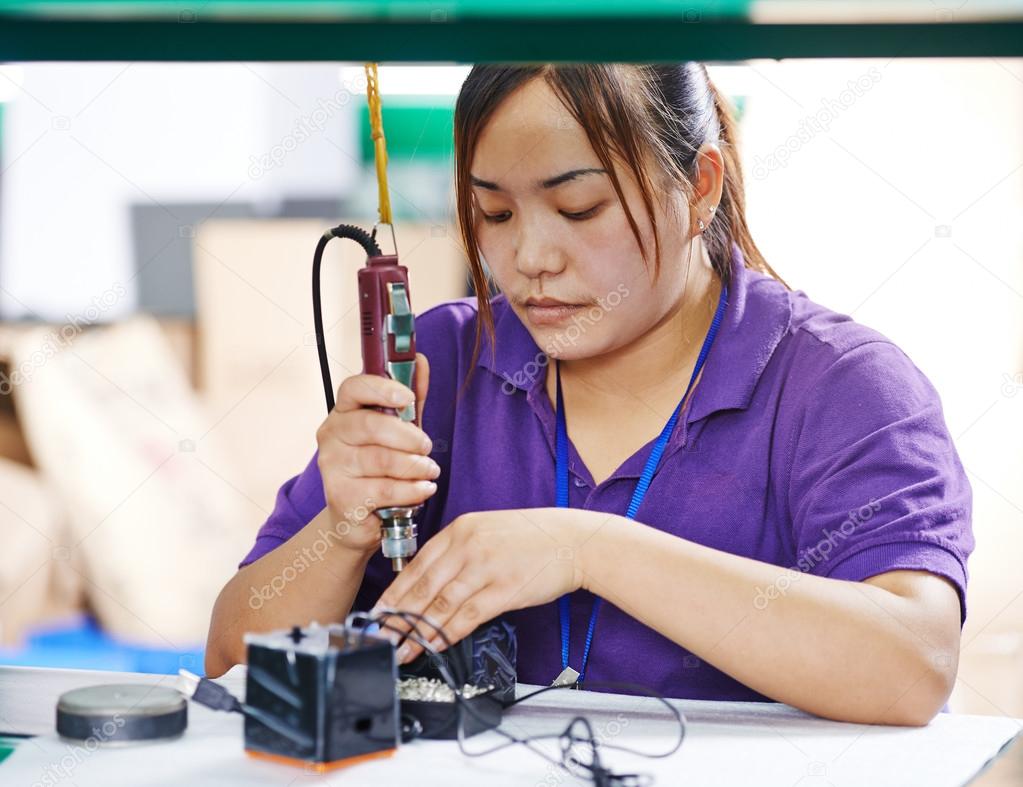 Female chinese worker in factory
