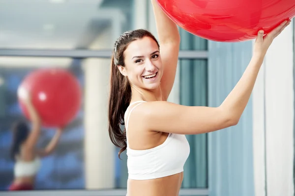 Happy healthy woman with fitness ball — Stock Photo, Image