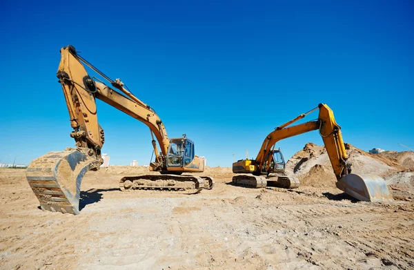 Track-type lader graafmachines op het werk — Stockfoto