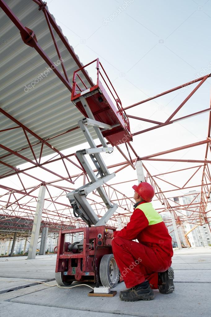 Construction worker with lift equipment